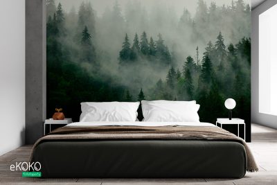 Foggy green fir forest on a hill - wall mural