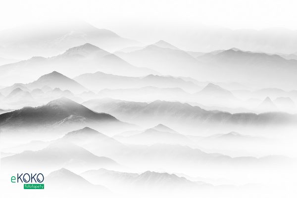 foggy mountain peaks - wall mural
