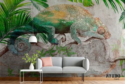 chameleon on a branch among tropical plants against a concrete background - wall mural