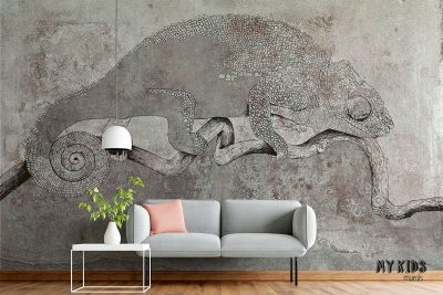 gray chameleon on a branch against a concrete background - wall mural