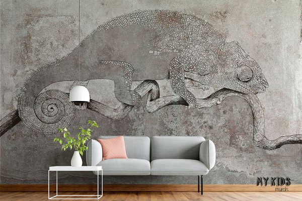 gray chameleon on a branch against a concrete background - wall mural