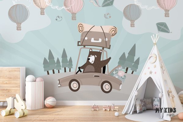 teddy bear is driving car with luggage while balloons are flying in the sky - children’s wall mural