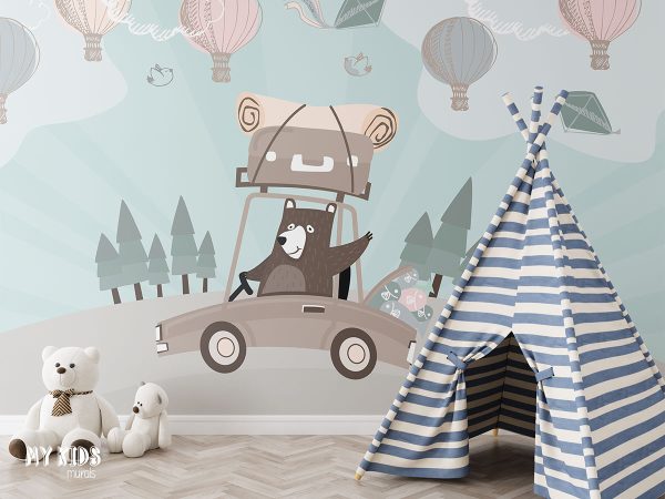 teddy bear is driving car with luggage while balloons are flying in the sky - children’s wall mural