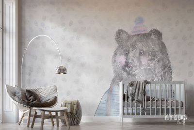 charming teddy bear in colorful hat and sweater against background of falling snowflakes - children’s wall mural